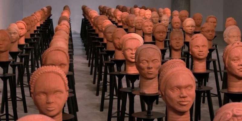 An army of sculptures of girls from Nigeria who were abducted by militants. Video